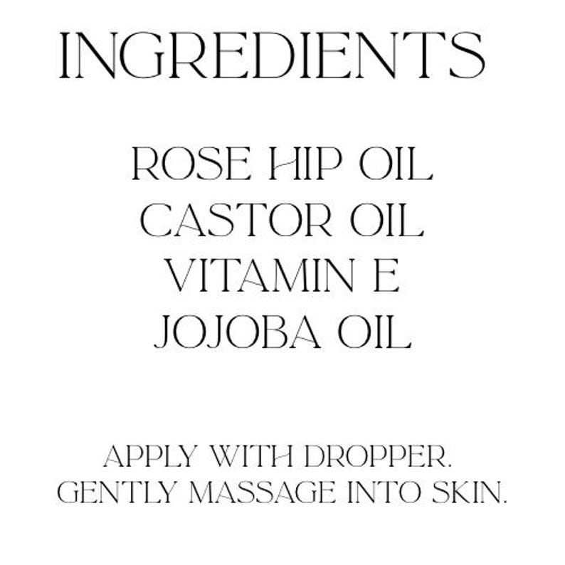 May include: White background with the word "INGREDIENTS" at the top. Below, the ingredients are listed: Rose Hip Oil, Castor Oil, Vitamin E, and Jojoba Oil. The text "APPLY WITH DROPPER. GENTLY MASSAGE INTO SKIN." is at the bottom.