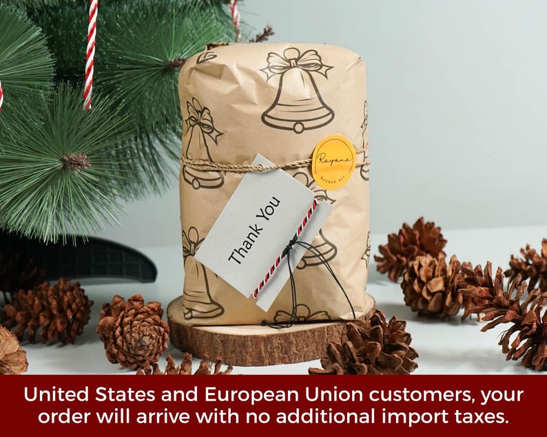 May include: A rectangular package wrapped in brown paper featuring a black line-art bell pattern. The package is tied with twine, secured with a round yellow sticker, and includes a white tag with the printed text Thank You in black ink.