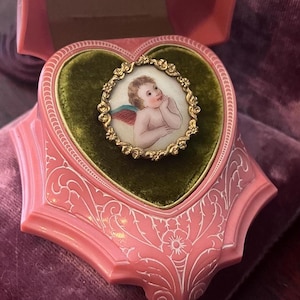 Antique Cherub Brooch with Floral Design