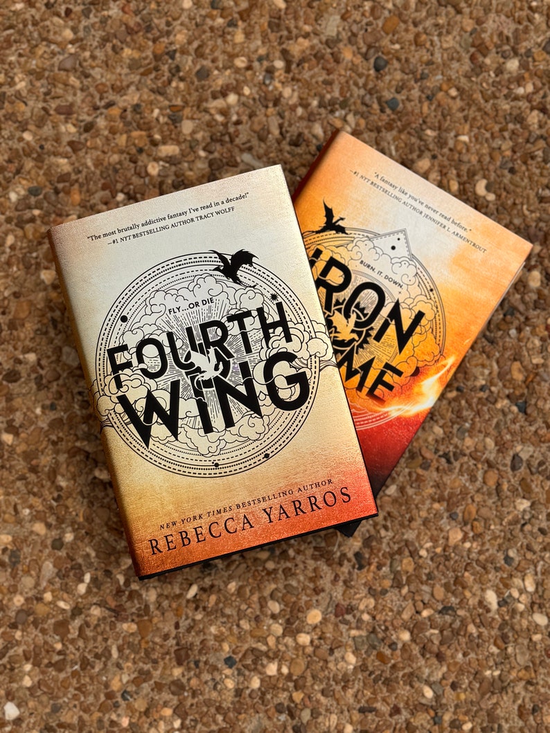 May include: Two fantasy novels, "Fourth Wing" and "Iron Flame", by Rebecca Yarros. The covers feature dragons and a fiery background.