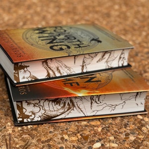 May include: Two fantasy novels stacked on top of each other. The top book is titled "Fourth Wing" and the bottom book is titled "Fire in the  Deep". Both books have black covers with gold and white illustrations.