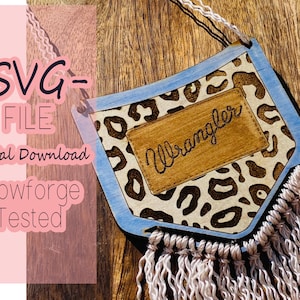 May include: Wooden wall hanging with a blue border and leopard print design. The word "Wrangler" is burned into a wooden patch. The image also includes the text "SVG FILE Digital Download Glowforge Tested".