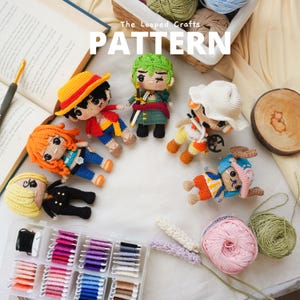 May include: Crochet amigurumi patterns for popular anime characters. The patterns include Luffy, Zoro, Nami, Chopper, and Sanji. The image shows the finished crocheted characters, yarn, and a container of embroidery floss.