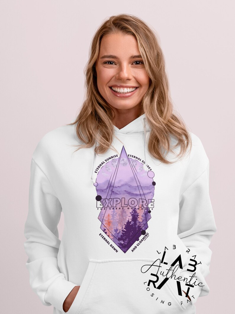 May include: White hoodie with a purple and pink geometric design featuring a mountain landscape and the text "EXPLORE THE GREAT OUTDOORS". The design also includes the text "Eternal Sunrise", "Eternal Sunset", "Eternal Dawn", and "And Gloaming".