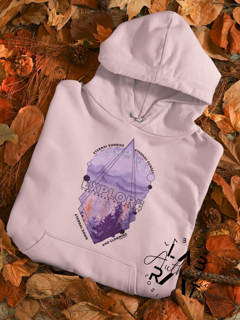 May include: A lavender hoodie with a geometric design featuring a watercolor landscape and the text "Explore the Great Outdoors" with the words "Eternal Sunrise", "Eternal Sunset", "Eternal Dawn", and "And Gloaming" around the design.