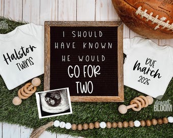 May include: A pregnancy announcement with a football, two white onesies, and a letter board. One onesie says "Halston Twins", the other says "Due March 2026". The letter board reads "I SHOULD HAVE KNOWN HE WOULD GO FOR TWO".