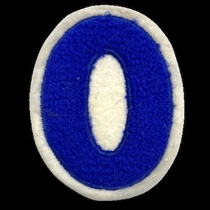 May include: Blue felt patch with a white felt outline in the shape of the number zero.