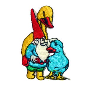 May include: An embroidered patch featuring a yellow duck, a red-hatted gnome, and a blue duckling. The gnome is holding the duckling in its arms.