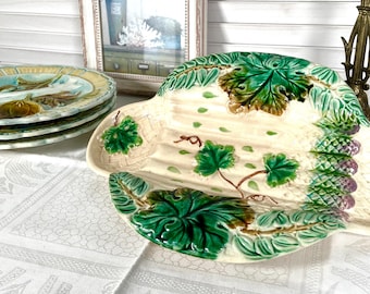 Large antique French dish plate with asparagus, mahogany, and saltworks, 19th century.