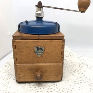 Old coffee grinder wood and sheet metal blue vintage
