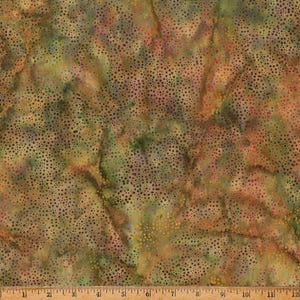 May include: Abstract fabric with a brown, green, and orange background. The fabric has a speckled pattern of small dots in various shades of brown, green, and orange.