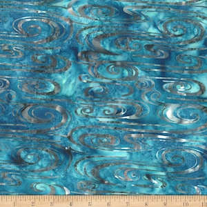May include: A vibrant fabric with a swirling water design in shades of teal and blue. Silver-colored, wave-like patterns overlay the background. The fabric is measured with a ruler in inches.
