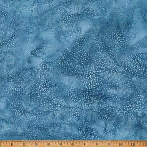 May include: A blue fabric with a white speckled pattern. The fabric has a subtle tie-dye effect.