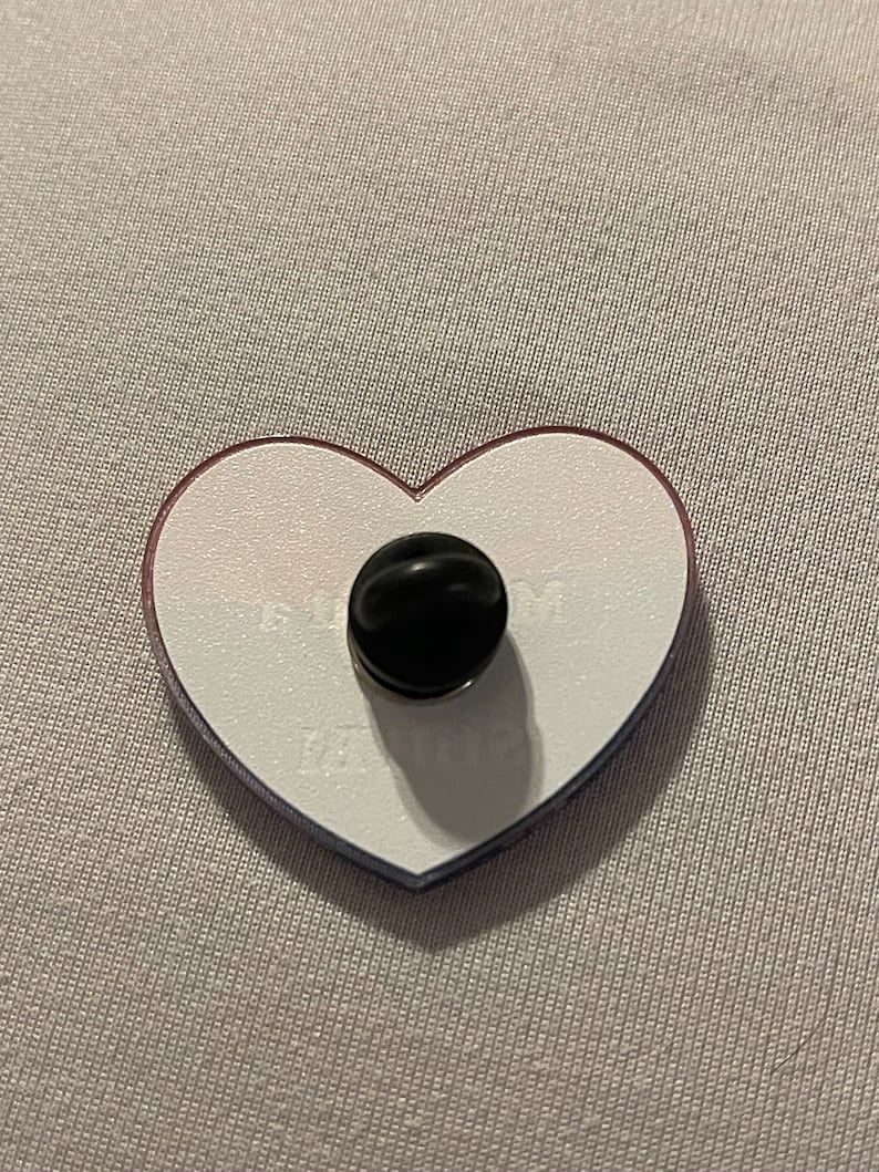 Heart Shaped Acrylic pin. Bi flag pink purple blue waving stripes. Text reads "Married a Guy Still Bi