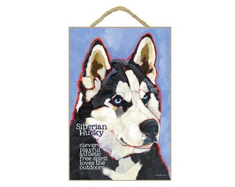 May include: A colorful painting of a Siberian Husky dog with blue eyes. The painting is on a wooden plaque with a rope hanger. The text "Siberian Husky" is written in red and black letters. Below the text is a list of characteristics of the breed: "clever, playful, athletic, free spirit, loves the outdoors."