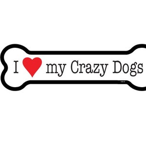 May include: A white bone-shaped sign with a black outline and the text "I ♥ my Crazy Dogs".