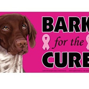 May include: A pink and black sign with a brown and white German Shorthaired Pointer dog. The sign says "BARK for the CURE" with pink ribbons on either side of the text.