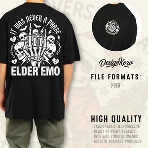 May include: Black t-shirt with a white graphic design featuring skulls, a skeleton hand, and the text "IT WAS NEVER A PHASE" and "ELDER EMO". The design is on the back of the shirt. A smaller version of the design is on the front.