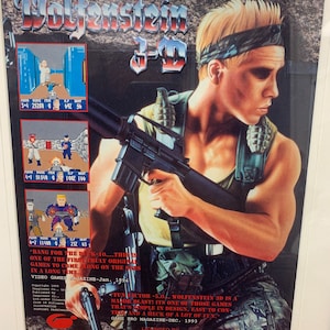 May include: A retro video game advertisement for Wolfenstein 3-D on the Super Nintendo Entertainment System (SNES). The ad features a pixelated image of the game's protagonist, a soldier holding a gun, and the text "Wolfenstein 3-D".