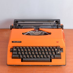 Adler Triumph Gabrielle 2000 - Eléctrica - Máquina de escribir vintage - Color naranja - Buen estado de funcionamiento - Portátil