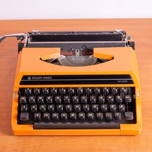 Silver Reed SR 200 - Orange - Like New - Superb Cosmetic & Working Condition - Rare Color - Made in Japan - 1970's