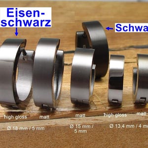 Pode incluir: Uma coleção de brincos de argola em acabamentos preto ferro e preto com texturas brilhantes e foscas. Os tamanhos incluem 18 mm por 5 mm, 15 mm por 5 mm e 13,4 mm por 4 mm. A imagem inclui etiquetas de texto identificando as cores.