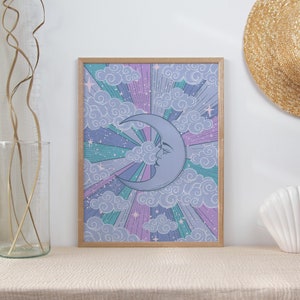 May include: A framed print of a crescent moon with a face, surrounded by clouds and stars in shades of purple, pink, and blue.