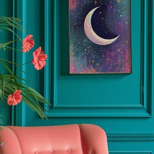 May include: A framed print of a crescent moon with gold stars on a purple and blue background. The print is hanging on a teal wall.