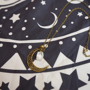 Brass crescent moon and clear quartz necklace