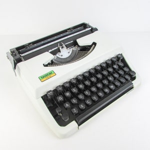 Vintage working typewriter Brother 100 1970s retro portable Japan White