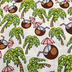 May include: A white fabric with a repeating pattern of green palm trees and brown coconuts with pink umbrellas and purple straws.