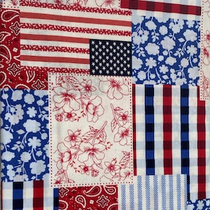 May include: A fabric featuring a patchwork design with various patterns including red and white stripes, a blue field with white stars, red paisley, blue and white floral prints, and red, white, and blue checkered and striped sections.