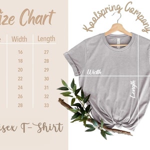 May include: Size chart for a unisex t-shirt, showing width and length measurements in inches for sizes XS to 3XL. The chart is printed on a light brown background. The image also shows a grey t-shirt on a hanger with the words "Koolspring Company" printed in a brown font.