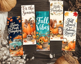 May include: Five rectangular bookmarks featuring autumn themes. Designs include a teal truck with pumpkins, a pumpkin with a plaid bow, a basket of pumpkins and sunflowers, a squirrel and hedgehog with pumpkins, and pumpkins with fall leaves.