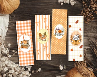 May include: Four rectangular bookmarks featuring orange and white patterns including gingham, stripes with bows, polka dots, and a grid. Each bookmark displays a central oval illustration of autumn-themed items like a pumpkin, books, a snail, and a ghost.
