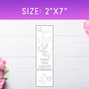 May include: A black and white printable bookmark featuring a superhero girl with the text "Mom you are my superhero" and sound effects like "Pow!" and "Bang!" The bookmark is 2 inches wide and 7 inches tall.
