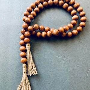 Handmade Maple Wood Bead Garland with Jute Tassels: Bohemian Wall Hanging