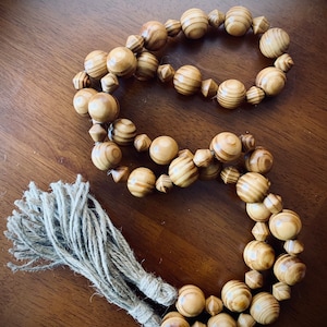 Rustic Wood Bead Garland with Jute Tassels: 58-inch Decorative Design