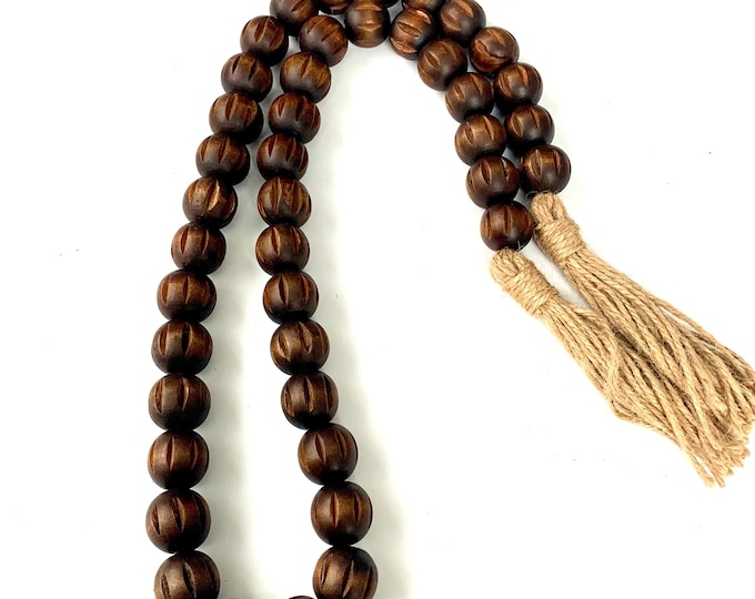 Rustic Espresso Wood Bead Strand with Carved Details and Earthy Jute Tassels
