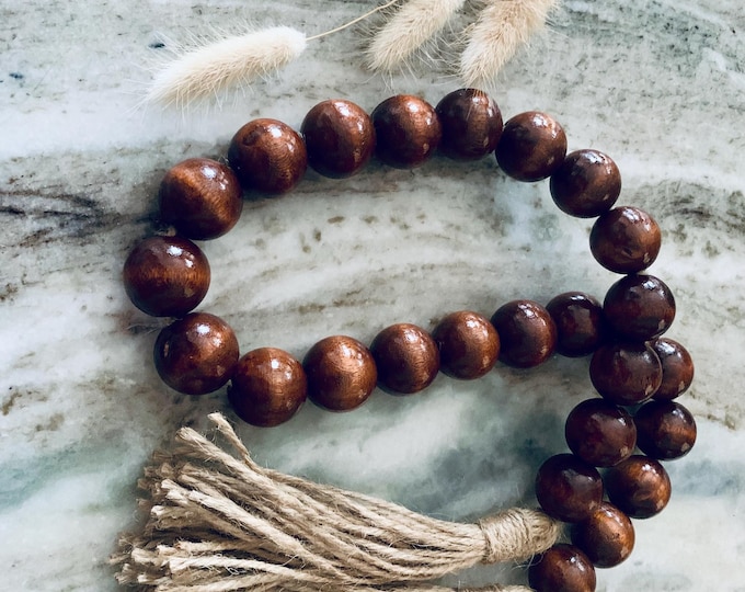 24-Inch Mahogany Wood Bead Strand with Elegant Tassels