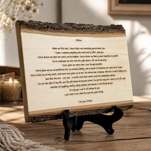 May include: A rectangular live-edge wood plaque featuring a laser-engraved letter addressed to Melissa. The text expresses deep affection and gratitude, detailing a decade of shared memories and love, concluding with the signature, I love you, Melissa.
