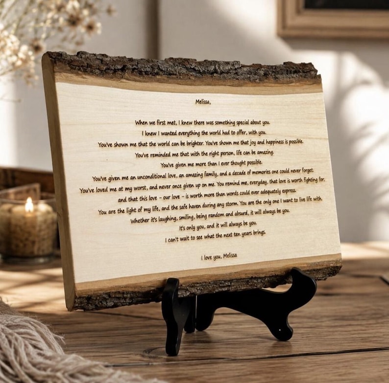 May include: A rectangular live-edge wood plaque featuring a laser-engraved letter addressed to Melissa. The text expresses deep affection and gratitude, detailing a decade of shared memories and love, concluding with the signature, I love you, Melissa.