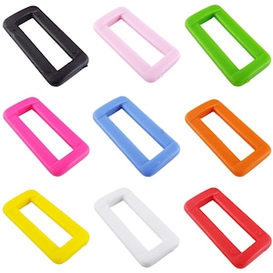 May include: Ten plastic slider buckles in various colours, including black, pink, green, blue, orange, yellow, white, and red. The buckles are rectangular with a rectangular opening in the centre.