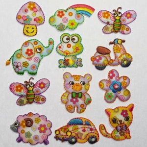 May include: A set of 12 colourful iron-on patches featuring various whimsical designs, including a mushroom, a cloud with a rainbow, a butterfly, a frog, a scooter, an elephant, a teddy bear, a flower, a sheep, a car, and a cat. The patches are perfect for adding a touch of personality to clothing, bags, or other fabric items.