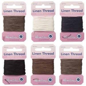 May include: Six spools of linen thread in shades of brown, cream, and black. Each spool is labelled "Linen Thread" and "Premium Quality" with the "Hemline" logo. The thread is 10 metres long.