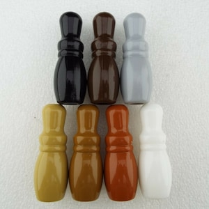 May include: Set of eight wooden curtain finials in various colours, including black, brown, grey, beige, gold, orange, and white.