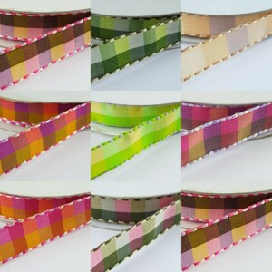 May include: Assortment of plaid ribbon with a stitched edge. The ribbon is available in a variety of colours, including pink, green, brown, and yellow.