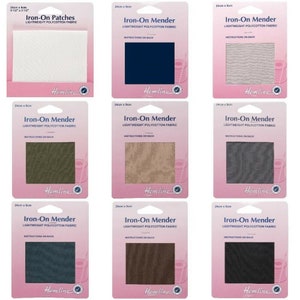 May include: Nine packs of iron-on patches and menders in various colours, including white, navy blue, beige, green, grey, dark blue, brown, and black. Each pack is 9 1/2 inches by 3 1/2 inches and features the Hemline brand name.
