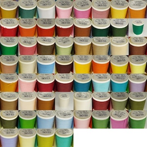May include: A collection of 64 spools of thread in various colours, each spool labelled with a colour number and the text "Nr. 12 - 200m".