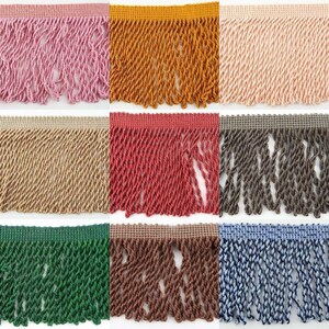May include: Assortment of 10 colours of twisted fringe trim. The colours are pink, orange, peach, beige, red, grey, green, brown, blue, and black.